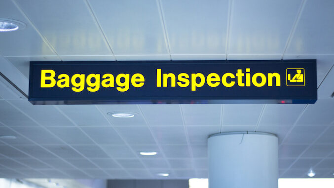 Airport baggage inspection sign